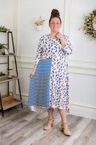 Modest high and low dress with ruffle sleeves and contrasting prints