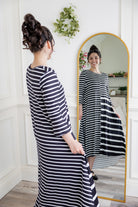 Modest high and low dress with ruffle sleeves and contrasting prints