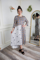 Modest high and low dress with ruffle sleeves and contrasting prints